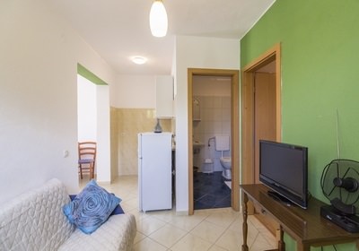 apartent yellow, living room and bathroom